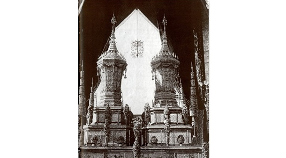 Urns for Princess Sudaratana Ratchaprayoon and Prince Chaturon Rasmi standing on two-step stands decorated with colour glass in the royal funeral hall