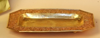 Picture 21 : The engraved golden tray for a tea set at the Pavilion of Regalia, Royal Decorations and Coins.