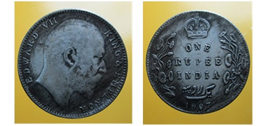 Silver coin, one rupee denomination The portrait of Queen Victoria is at the center.