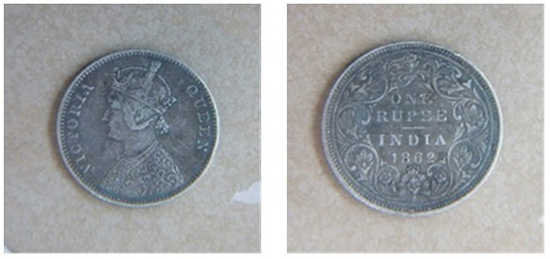 Silver coin, one rupee denomination The portrait of King Edward VII is at the center.
